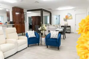 A living room with white and blue couches.