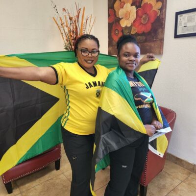 Two women holding a flag.