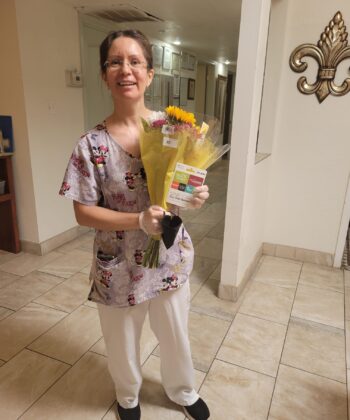 A person holding a bouquet of flowers.