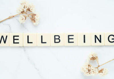 Wellbeing word printed each letter in a tile. - Sunrise Assisted Living